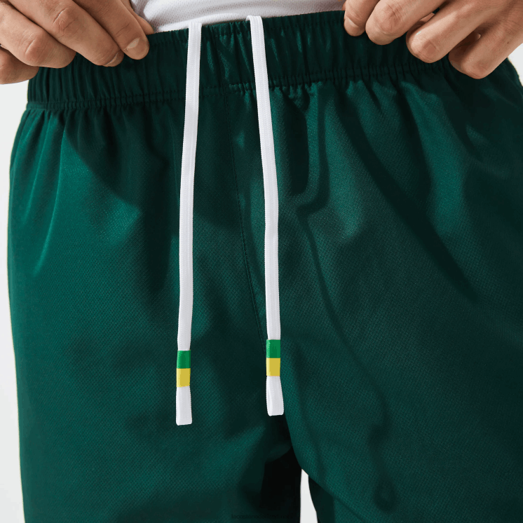 Lacoste lichtgewicht sportbroek met contrasterende banden 0828H1362 groen geel wit 117 Heren