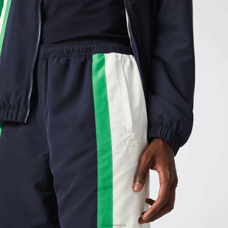 Lacoste lichtgewicht waterafstotende trainingsbroek met kleurvlakken 0828H1180 marineblauw wit groen 19v Heren