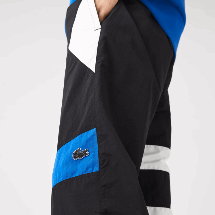 Lacoste patchwork waterafstotende trainingsbroek 0828H1105 zwart blauw wit se1 Heren