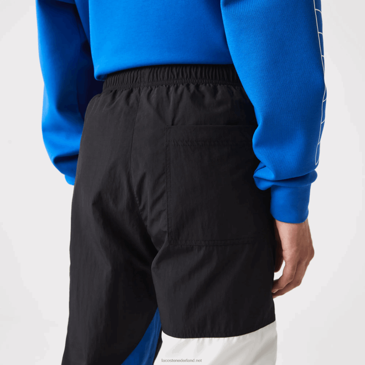 Lacoste patchwork waterafstotende trainingsbroek 0828H1105 zwart blauw wit se1 Heren