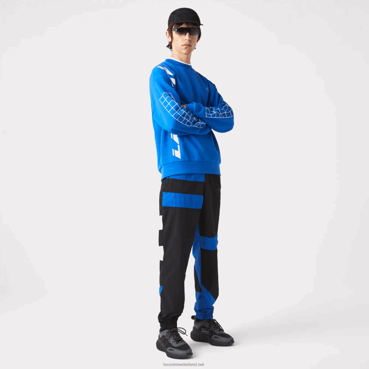Lacoste patchwork waterafstotende trainingsbroek 0828H1105 zwart blauw wit se1 Heren