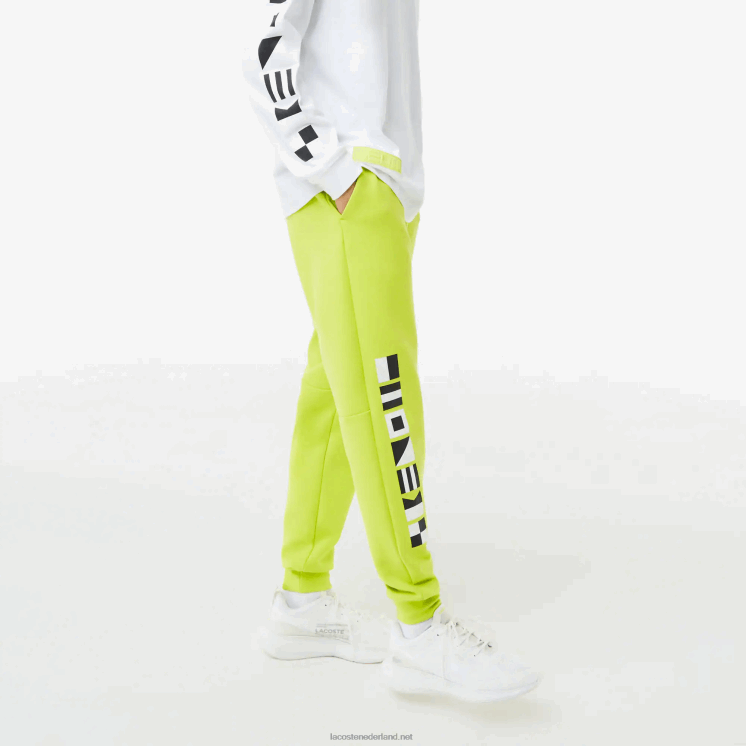 Lacoste trainingsbroek met reflecterende print 0828H1046 geel 90v Heren