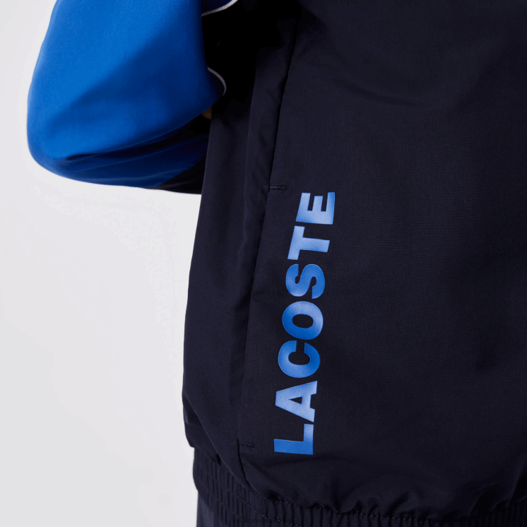 Lacoste sport trainingspak met kleurvlakken 0828H3209 marineblauw 976 jongens