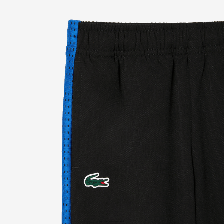 Lacoste tennis joggingbroek met kleurvlakken 0828H3047 zwart blauw geel av jongens