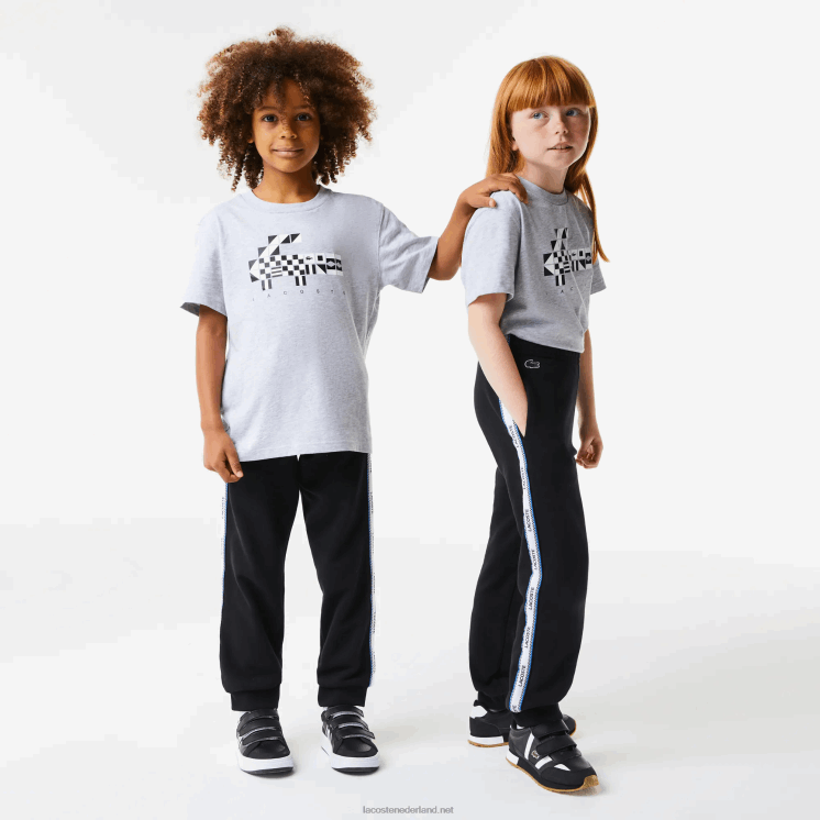 Lacoste trainingsbroek met bedrukte banden 0828H3223 zwart blauw 985 kinderen
