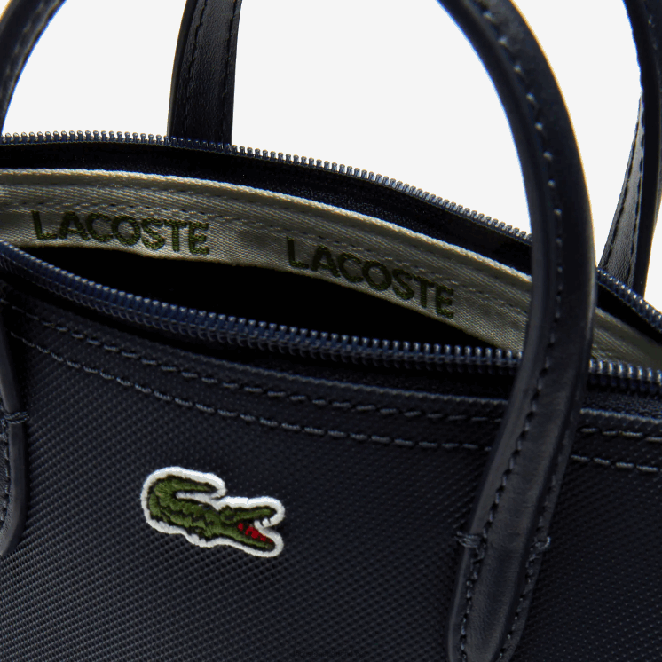 Lacoste l.12.12 concept petit pique gecoat canvas mini draagtas met rits 0828H2819 zonsverduistering 141 vrouwen